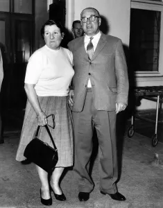 Worried Prints: Sport. Motor Racing: Alfred Moss and wife parents of Stirling Moss seen here leaving