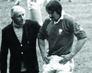 01405 Prints: Sport - Rugby - England v Wales - 1980 - Paul Ringer is escorted from the field following