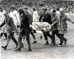 March Prints: Sport - Rugby - Swansea v Pontypool - Swansea and Wales No 8 Mervyn Davies is carried of