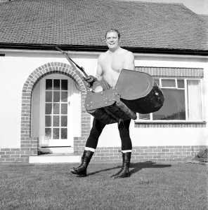 Wrestler Prints: Sport Wrestling Wrestler Ray Diamond holding a lawnmower. November 1969 Z10596-001
