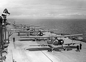 Squadron of Fairey Swordfish planes prepare to launch from the flight deck of the Royal