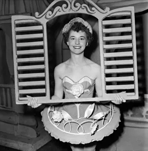 00021 Collection: And through the square window. Chorus girl holding window frame