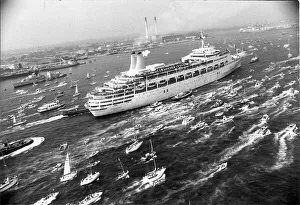Boats Prints: SS Canberra returns to Southampton after the Falklands War service escorted by small