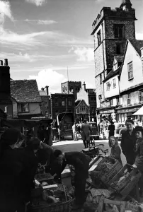 Stalls Prints: St Albans market square, scene of bustle and domestic activity after years of hectic