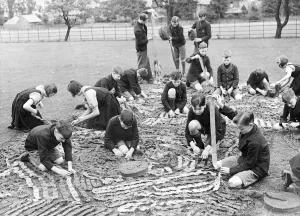 Camouflage Prints: St George Orphanage. Children making camouflage nets. Caption is hard to