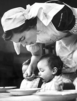 Caring Prints: A St Johns nurse at work at the Villa Day Nursery opened for the express purpose of