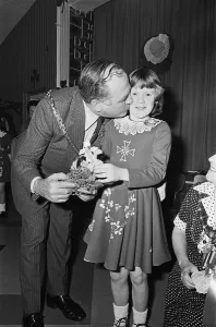 Mare Prints: St Patricks Day in Teesside, a young girl gets a kid from the Mayor