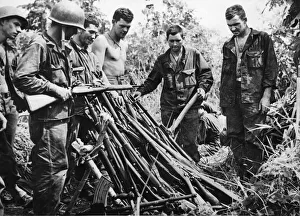 A stack of rifles and light machine guns captured from the Japanese at Sanananda