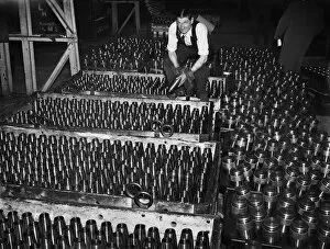 01343 Collection: Stacking shells for anti-aircraft guns in a midland shell factory. 4th October 1939