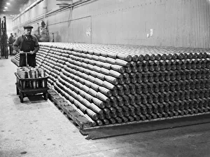 Stacking shells for anti-aircraft guns in a midland shell factory. 4th October 1939