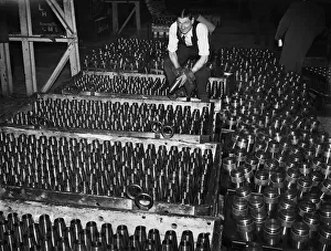 Stacking shells for anti-aircraft guns in a midland shell factory. 4th October 1939