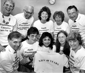 00080 Prints: Staff at Coventrys Family Practitioner Committee show off the tee shirts chosen to