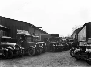 Commercial Prints: The staff of Uxbridge builders merchants Kirby Brothers pose beside their lorries