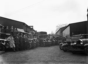 00717 Prints: The staff of Uxbridge builders merchants Kirby Brothers pose beside their lorries