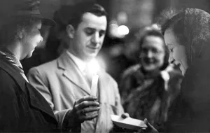 Electricity Prints: A stallholder desplays his wares by the light of a candle in Newcastles Grainger Market