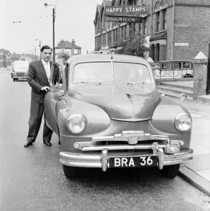 Standard Vanguard car with humourous registration number plate BRA 36. 1955