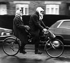 Stanley (70) and Erna (63) Livingstone, riding their tandem bike in Renfrew, Scotland