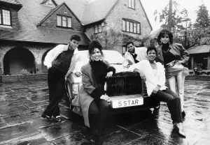 Five Star pop group stand outside mansion in Berkshire with new Rolls Royce Dbase