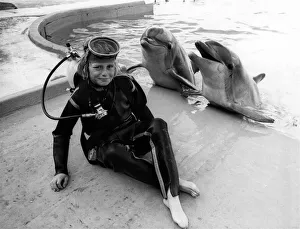 Starring Douglas and the Dolphins. Dolphins think the world of young Douglas Lambert