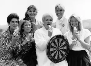 Stars of the BBC soap Eastenders cool off with ice-creams in the heat during a visit to
