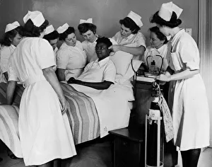 00096 Prints: State hospital nurses learning how to administer oxygen by spectable frames