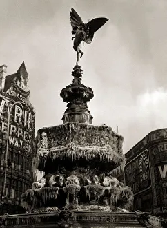 Capital Prints: The statue of Eros in London - February 1956 the fountain has frozen over forming