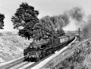 Rural Scene Prints: A steam locomotive engine making its way through the Warwickshire countryside, circa 1950