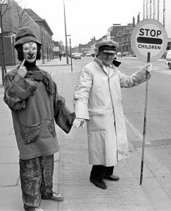 Road Safety Prints: Stephanie Fagan in full clown war paint meets and makes friends with a nervous lollipop