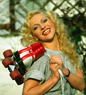 Stephanie Lawerence carrying roller skates April 1983
