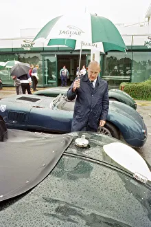 Sterling Moss with a C-Type Jaguar which he piloted to Le Mans 40 years ago