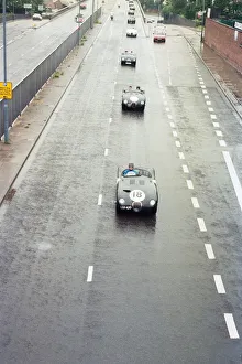 Sterling Moss takes takes Evening Telegraph reporter Alan Poole for a spin in the same