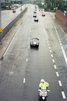 Sterling Moss takes takes Evening Telegraph reporter Alan Poole for a spin in the same