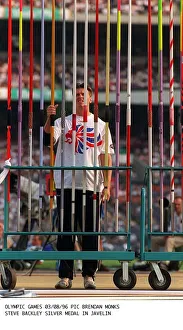 Javelin Prints: Steve Backley javelin thrower of Great Britain choosing his javelin before winning