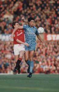 Steve Bruce finds his way barred by Robert Rosarios elbow during Coventry City
