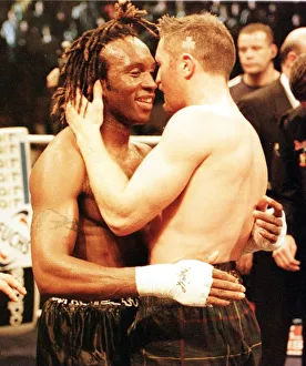 Steve Collins celebrates after beating Nigel Benn (L) in the WBO middleweight fight in