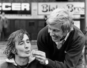 Steve Kember of Crystal Palace has make up applied by teammate Alan Birchenhall