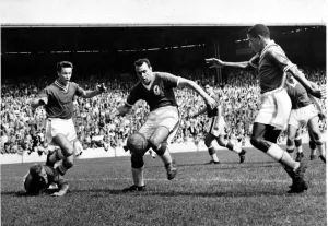 and Steve Mokone battle for the ball in the Liverpool goalmouth during their teams 3-2