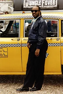 00093 Prints: Stevie Wonder Singer arrives at his press conference in an New York yellow cab