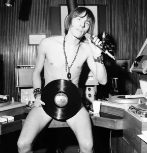 Stewart Henry the disc jockey broadcasting from a studio at the BBC this afternoon on his