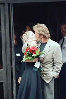 Kiss Prints: Sting holds and his bride Trudie Styler outside Camden register office, London