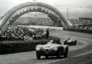 Motor Sport Prints: Stirling Moss 7. 11 / 06 / 01Filer of Stirling Moss at the wheel of Jaguar C type