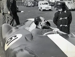 STIRLING MOSS IN HIS COOPER CLIMAX CHATS TO GEOFFREY BRABHAM, AGED 4 OF SYDNEY, AUSTRALIA
