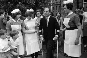 Stirling Moss leaving Atkinson Morley Hospital in Wimbledon