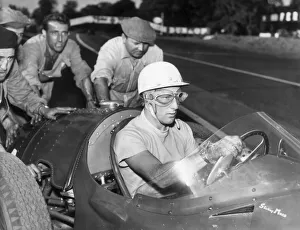 STIRLING MOSS PASSES SALLY WESTON IN THE FERRARI PIT - (NO DATE