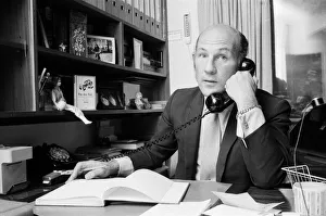 01157 Prints: Stirling Moss pictured in his office / home in Shepherds Market, London. 3rd August 1973