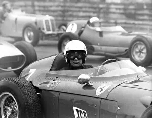 01419 Collection: Stirling Moss sitting in Ferrari Dino racing car at Historic Car Championship Race at