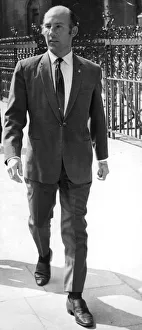 Stirling Moss walking in street - April 1968 ----- STIRLING