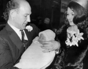 stirling moss and wife elaine and daughter allison aged five weeks at her cchristening