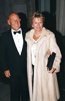Stirling Moss and wife Susie wearing a fur coat at sports awards ceremony - December 1994