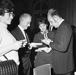 Stirling signing autographs at the Daily Mirror Motoring Celebrity Dinner at the Savoy